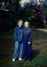 Shows Marie and Jill Wallace standing outside their old home in Marysville in Victoria.