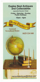 Shows an advertising brochure for Eagles Nest Antiques and Collectables located in Buxton in Victoria. Shows the name of the business and its location along with the opening hours at the top. Shows a ribbon like banner with the owners name on it with a mobile phone number underneath. Shows a photograph of a collection of antiques placed on a table with the business's website details along the lower edge of the brochure.