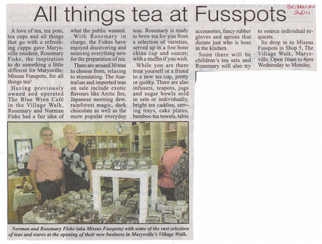 Shows a newspaper article regarding the tea shop called Missus Fusspots in Marysville in Victoria. Shows the owners in their shop.