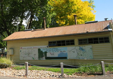 Shows the maps of Marysville and the surrounded areas that were painted on the outside wall of The Corner Cupboard Cafe in Marysville.