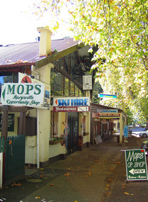 Shows the In Neutral Restaurant and Cafe in Marysville in Victoria. Shows the view looking down the row of shops in Murchison Street in Marysville.