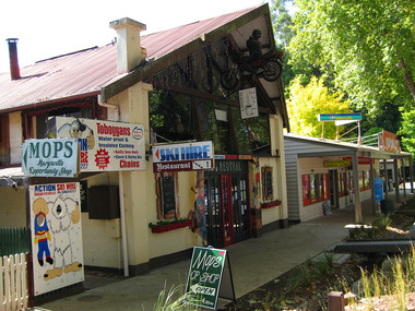 Shows the In Neutral Restaurant and Cafe in Marysville in Victoria. Shows the view looking down the row of shops in Murchison Street in Marysville.