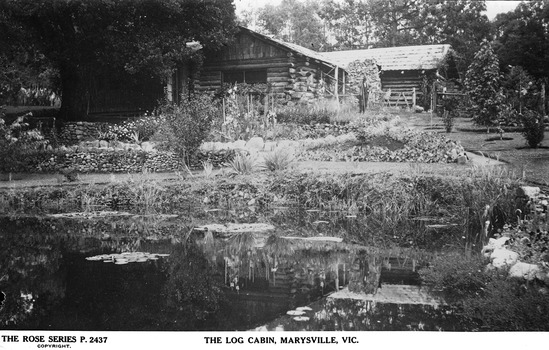 Shows the lily pond and garden in front of The Log Cabin in Marysville in Victoria.