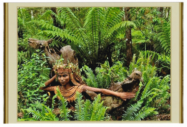 Shows a terracotta sculpture of a woman wearing Egyptian dress with an eagle like bird. There are plant growing out of the woman's head piece.