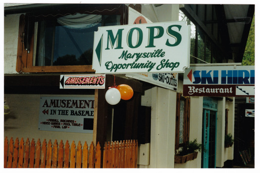 Shows a colour photograph of the entrance way to MOPS-Marysville Opportunity Shop.