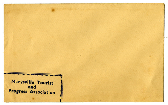 Shows an envelope from the Marysville Tourist and Progress Association. Shows an image of a rubber stamp of the Association in black ink.