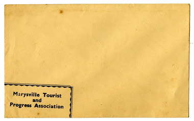 Shows an envelope from the Marysville Tourist and Progress Association. Shows an image of a rubber stamp of the Association in black ink.