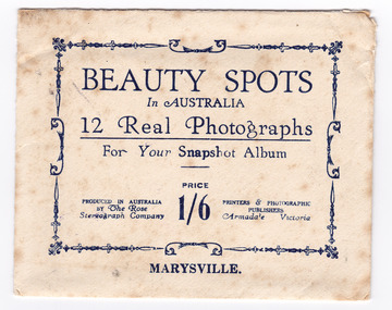A souvenir envelope that contained a series of photographs of scenic attractions taken in and around Marysville in Victoria that was produced by the Rose Stereograph Company. Reverse shows a purple ink stamp from The Log Cabin in Marysville.