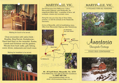 Shows an information brochure for Anastasia Fairytale Cottage in Marysville. Front shows a photograph of a wooden cottage surrounded by forest and another photograph of the cottage covered in snow. Middle shows a series of photographs of the interior of the cottage and a series of four photographs taken during the four seasons. Reverse shows two photographs of the scenery on the journey to Marysville along with a map of the journey and contact details for the cottage.