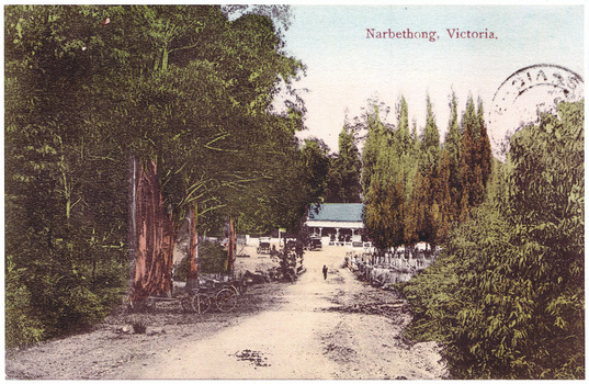 Shows a copy of a colour tinted postcard of the Black Spur Hotel at Narbethong. Shows a building with a verandah with several people standing on the verandah. In front of the building is an early model car as well as a few horse-drawn coaches and drays. A man can be seen walking up the entrance driveway. 