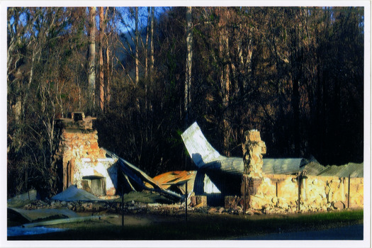 Shows The Log Cabin in Marysville in Victoria. Shows the remains of the building after it was destroyed in the 2009 Black Saturday bushfires.