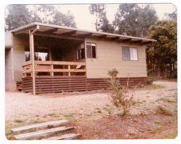 Shows a set of eight photographs of the exterior and interior of Blackwood Cottages in Marysville. Also shows photographs of the gardens surrounding the cottages.