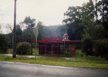 Shows the grounds of Magic Creek Nursery in Marysville in Victoria after it went out of business. Shows the roof of a gazebo in the background.