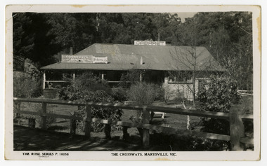A black and white photograph of the Crossways historic inn in Marysville in Victoria. The reverse has a space to write a message and an address and to place a postage stamp. The postcard is unused.