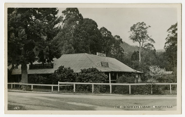 A black and white postcard of the Crossways Cabaret in Marysville in Victoria. On the reverse is a space to write a message and an address and to place a postage stamp. The postcard is unused.