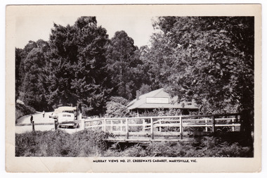 A black and white postcard of the Crossways Cabaret in Marysville in Victoria. On the reverse is a space to write a message and an address and to place a postage stamp. The postcard is unused.