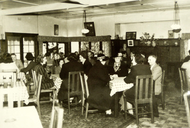 A black and white photograph of the dining area in The Crossways in Marysville.