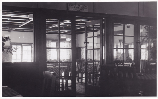 A black and white photograph of the view looking from the supper room into the dance room at the Crossways Cabaret in Marysville.