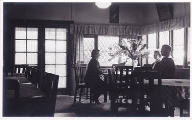 A black and white photograph taken in a dining area in the Crossways Cabaret in April, 1949.