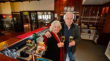 A digital copy of a colour photograph taken of the proprietors inside the interior of The Crossways in Marysville.