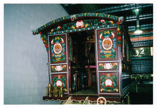 Shows the rear view of the Romany Vardo gypsy wagon that was housed in The Marysville Museum in Marysville in Victoria. Shows the ornately painted doors leading into the interior of the wagon.