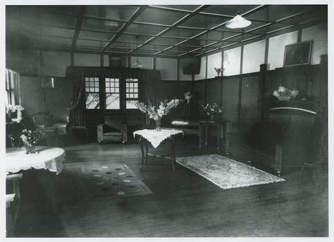 A black and white photograph of a room in the interior of Kerami Guest House. Kerami Guest House was located in Marysville.