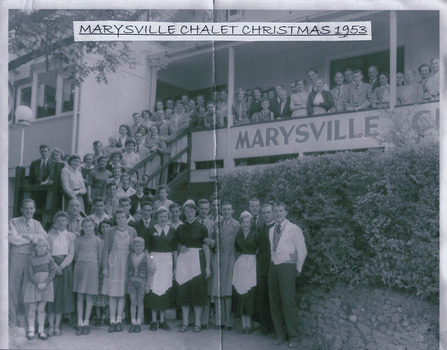 A black and white photograph of the staff and guests staying at The Marysville Chalet taken on Christmas Day 1953.