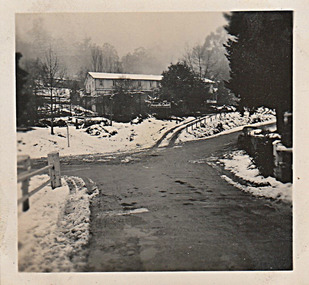 A digital copy of a black and white photograph of the Marysville Chalet taken in winter.