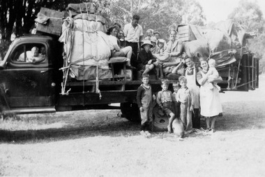 A digital copy of a black and white photograph of the Dickinson and Gould's families.