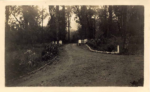 A digital copy of a black and white photograph of the entrance gates to Mount Kitchener House in Marysville that was taken in 1930.