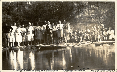 A digital copy of a black and white photograph taken at Mount Kitchener House in Marysville. The photograph was taken at Easter in 1938 and is of an unknown group of people standing next to what appears to be a lake.