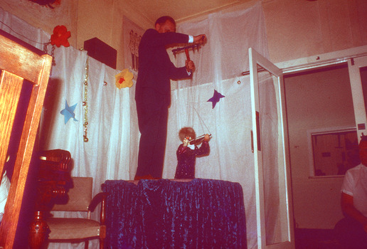 A series of five digital color photographs taken of a puppet show that was performed at Mountain Lodge in Marysville in 1970.