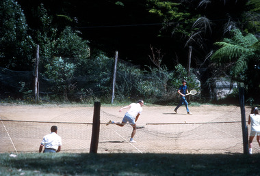 Digital copies of two photographs of unknown people playing tennis at Mountain Lodge in Marysville in 1971.