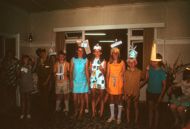 A series of three digital copies of colour photographs taken at a Fancy Hat Night that was held at Mountain Lodge in Marysville in 1971.