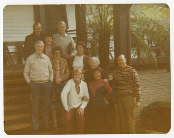 A colour photograph of a group of guests standing in front of Mountain Lodge in Marysville that was taken in September, 1983.