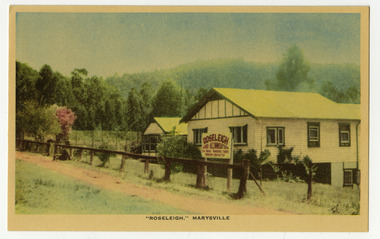 A colour postcard from Roseleigh guest house in Marysville that was produced by Nucolorvue Productions as a souvenir of Marysville. On the reverse is a space to write a message and an address and to place a postage stamp. The postcard is unused.