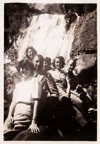 A black and white photograph of an unknown group of people at Steavenson Falls in Marysville. The photograph was taken in about 1944 during a stay at Roseleigh guest house in Marysville.