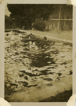 A black and white photograph of an unknown woman and child in the swimming pool at Roseleigh in Marysville. The photograph was taken in 1954.