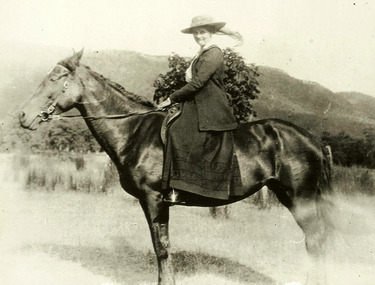 A digital copy of a black and white photograph of Emily Batchelor on horseback. The Batchelor Family owned and operated Taggerty House near Taggerty in Victoria.