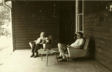 A digital copy of a black and white photograph of an unknown couple named as Claire and Rick on the verandah at Taggerty House near Taggerty in Victoria. The photograph was taken in 1983.