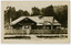 A black and white photograph of The Bungalow in Marysville. The Bungalow was built in 1917 by the Cuzens Bros. Builders for Frederick and Vera Barton. The postcard was produced by the Rose Stereographs as a souvenir of Marysville. On the reverse of the postcard is a space to write a message and an address and to place a postage stamp. The postcard is unused.