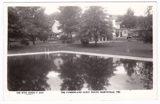 A black and white postcard of The Cumberland Guest House in Marysville. The postcard was produced by the Rose Stereograph Co. as a souvenir of Marysville. On the reverse of the postcard is a space to write a message and an address and to place a postage stamp. The postcard is unused.