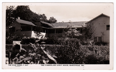 A black and white postcard of The Cumberland Guest House in Marysville. The postcard was produced by the Rose Stereograph Co. as a souvenir of Marysville. On the reverse of the postcard is a space to write a message and an address and to place a postage stamp. The postcard is unused.