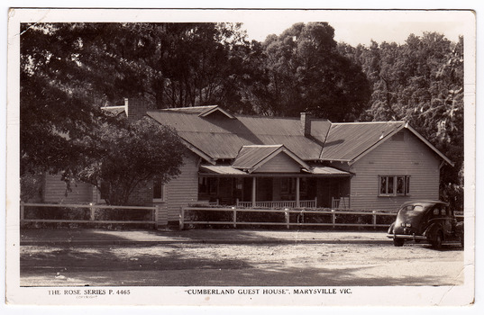 A black and white postcard of the Cumberland Guest House in Marysville. The postcard was produced by the Rose Stereograph Company as a souvenir of Marysville. On the reverse of the postcard is a space to write a message and an address and to place a postage stamp. The postcard is unused.