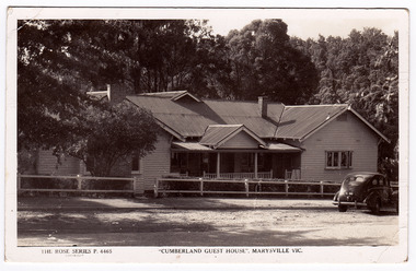 A black and white postcard of the Cumberland Guest House in Marysville. The postcard was produced by the Rose Stereograph Company as a souvenir of Marysville. On the reverse of the postcard is a space to write a message and an address and to place a postage stamp. The postcard is unused.