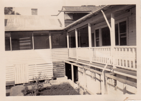 A black and white photograph of the view of the verandah from a guest's room at The Cumberland in Marysville. The photograph was taken in 1953.