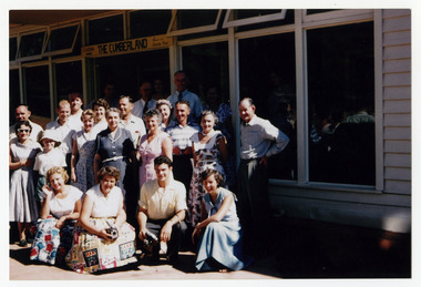 A colour photograph of an unknown group of people outside The Cumberland guest house in Marysville. The photograph was taken in the late 1950s to early 1960s.