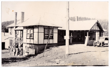 A black and white photograph of Fryday's Australian Hotel in Marysville. The hotel was originally built and opened by the Keppel Family in 1865 and named the Keppel's Australian Hotel. It was the first hotel to be opened in Marysville. In 1921 the licence to the Keppel's Australian Hotel was transferred to Emma Fryday and it was renamed the Fryday's Australian Hotel. The Keppel Family were among Marysville's earliest pioneering families. The photograph was taken in the 1930s.