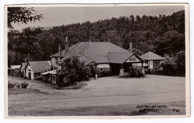 A black and white postcard of the Australian Hotel in Marysville that was produced by The Valentine Publishing Co. Pty. Ltd. as a souvenir of Marysville. The hotel was originally built and opened by the Keppel Family in 1865. The Keppel's Australian Hotel was the first hotel to be opened in Marysville. The Keppel Family were among Marysville's earliest pioneering families. On the reverse is a hand written message.