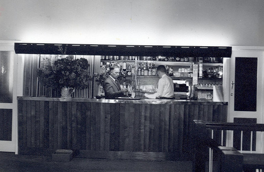 A digital copy of a black and white photograph of the bar at the Marysville Hotel Motel in Marysville. The original photograph was taken in 1962.
